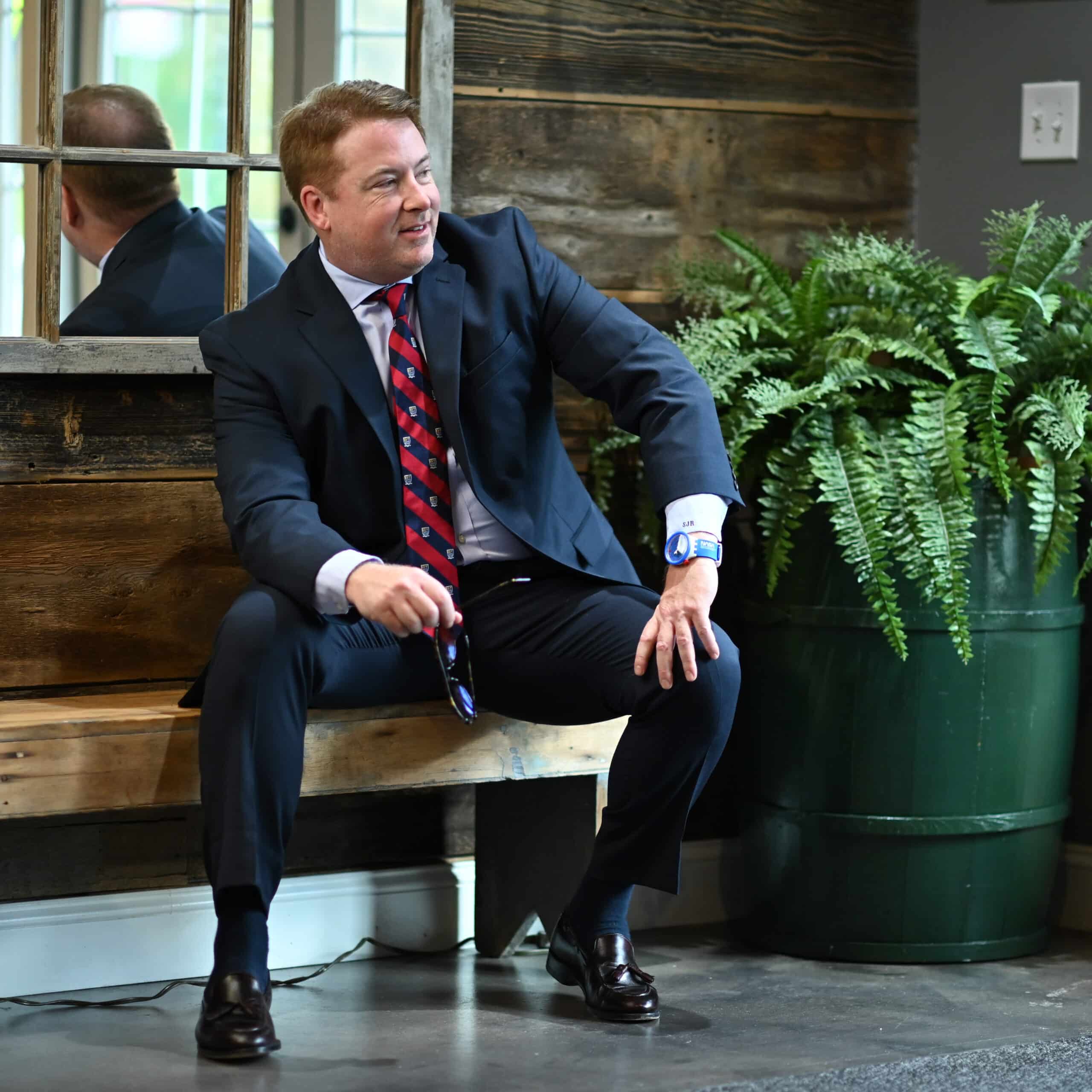 Stephen J. Ross sitting down in discussion